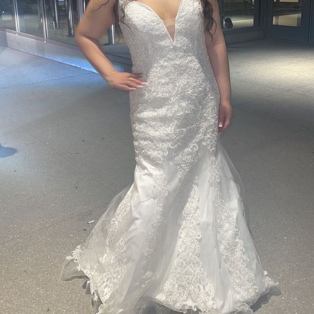 Selling my wedding dress, lace all over the top an mid section of the dress.